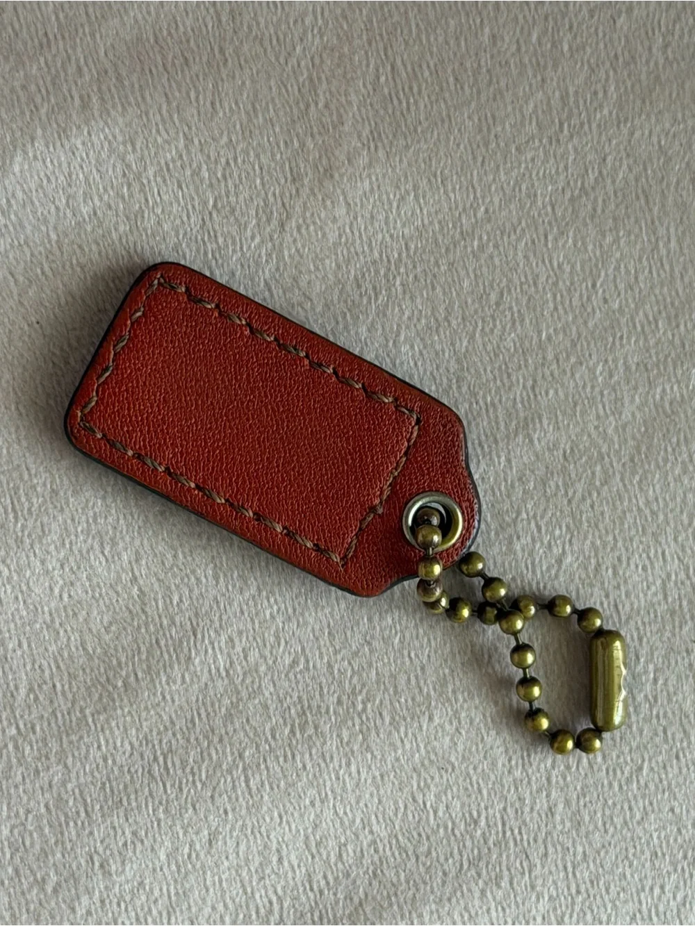 COACH Small Orange Leather Hangtag🧡